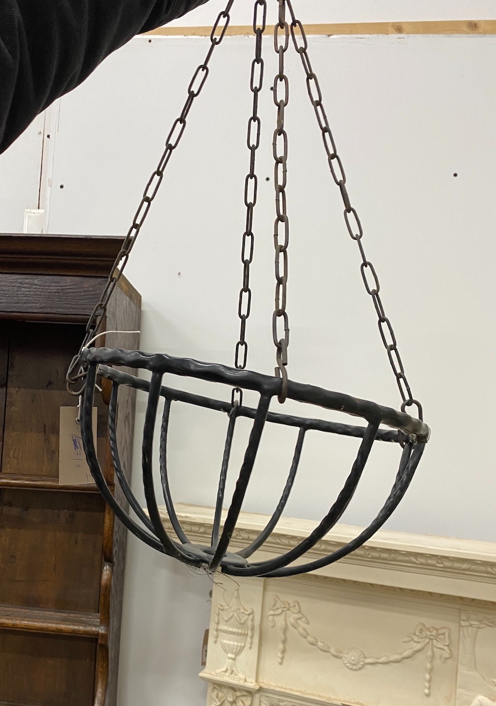 Three metal hanging baskets, a wall mounted pot holder and a stand
